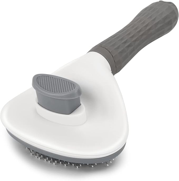 White and gray pet grooming brush on a white background